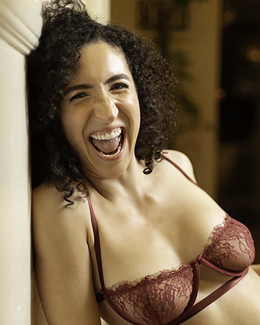 A woman taking a break in a shoot to celebrate