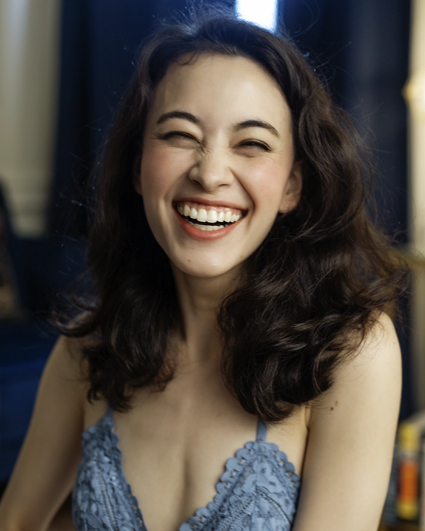 Headshot of a very happy woman smiling